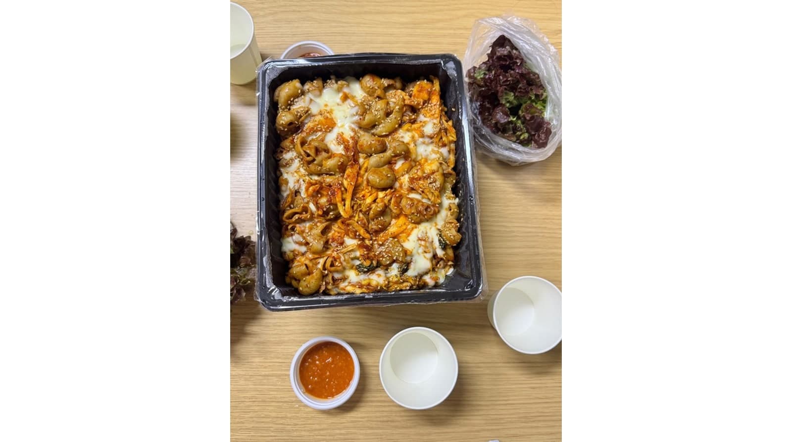 용기에 담긴 곱창 포장 모습 — 본점 공개 방문 사진
